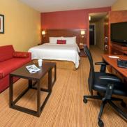 King Guestroom King bed with Sleeper Sofa. Complimentary Wifi. Two phones. Refrigerator. Work Desk. Photo 2