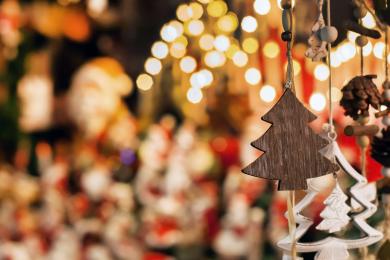 Handmade wood ornaments are displayed on a Christmas Tree at a holiday market in Winston-Salem
